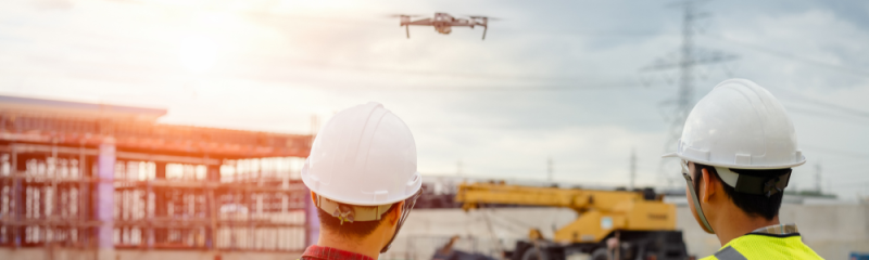 using a drone alongside construction machinery